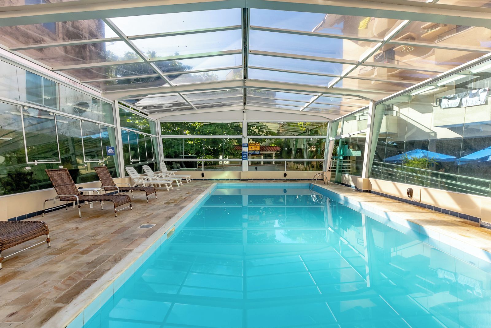Outdoor pool, a heated pool, open 10:00 AM to 10:00 PM, sun loungers
