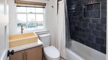 Shower, hair dryer, towels, shampoo