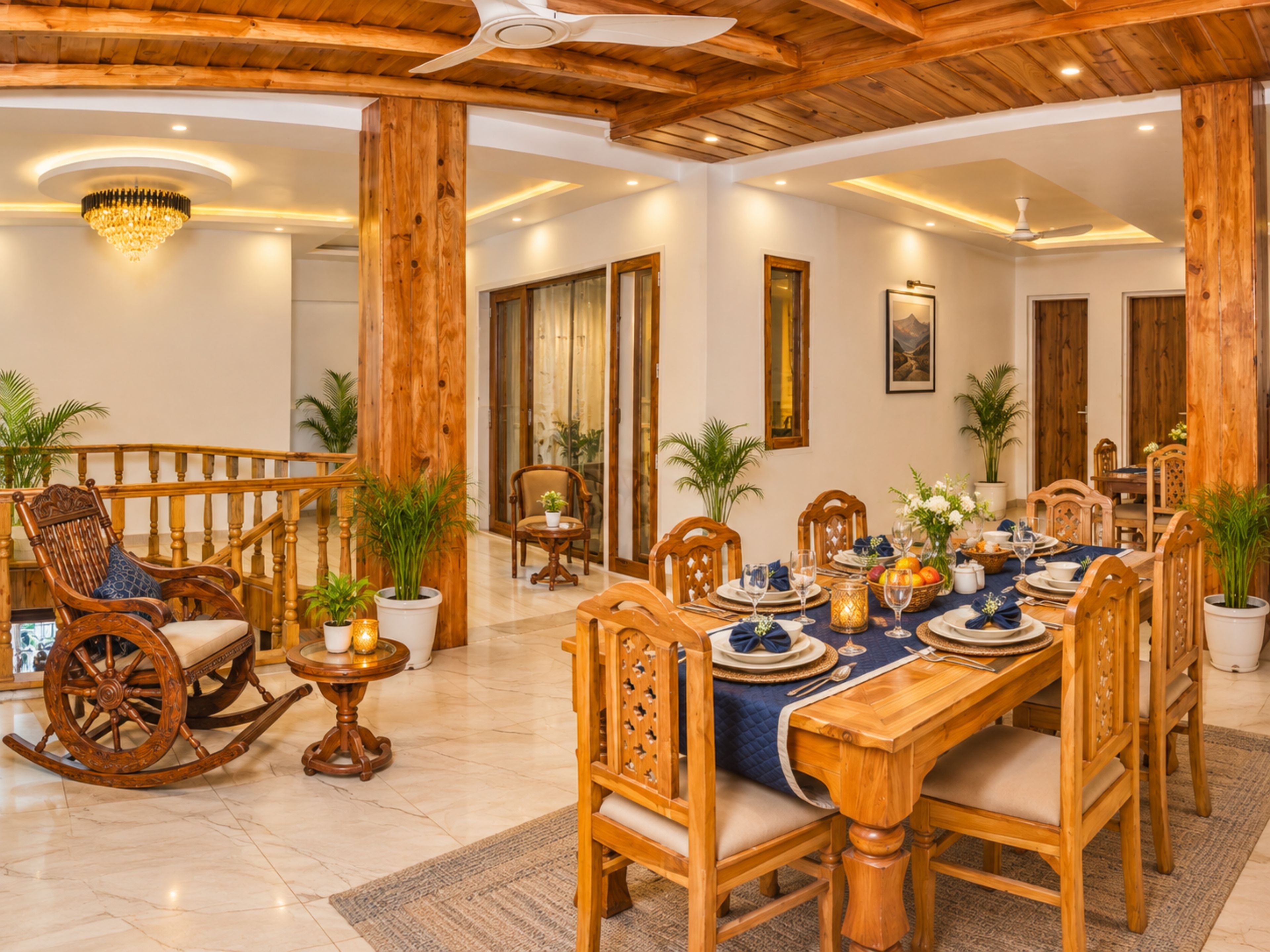 A dining area with a wooden table set for a meal, surrounded by wooden chairs.