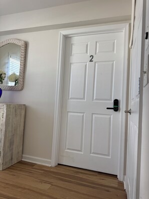 A white door with a number '2' and a modern electronic lock. -  Cozy1 bedroom Apt 1.5 bath in wonderful Ocean City near28st 2mints to boardwalk (Ocean City)