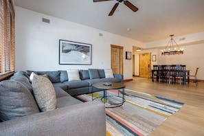 Settle into plush sectional seating and let the open-concept living space welcome you. Vaulted ceilings and natural light create an airy atmosphere perfect for gathering with loved ones. - EL5109 | Private Hot Tub | Winter Shuttle | Air Chilling | Pool (Steamboat Springs)