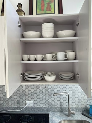 A kitchen with white cabinets, a hexagonal tile backsplash, and a stainless steel sink. - Lovely 2 Bedrooms Apartment With Terrace, Small Pool Share (San Juan)