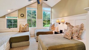 A bedroom with two beds, a clock, and a window with a view of greenery. - Three Kings Condo by Avantstay Walk To Slopes Shared Pool + Spa Near Main St (Park City)