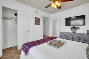 A bedroom with a bed, a ceiling fan, a television, and a dresser. - GEM/3BD/flex office space/sleeps 6/private 2 car garage/20 min strip & airport, (Las Vegas)
