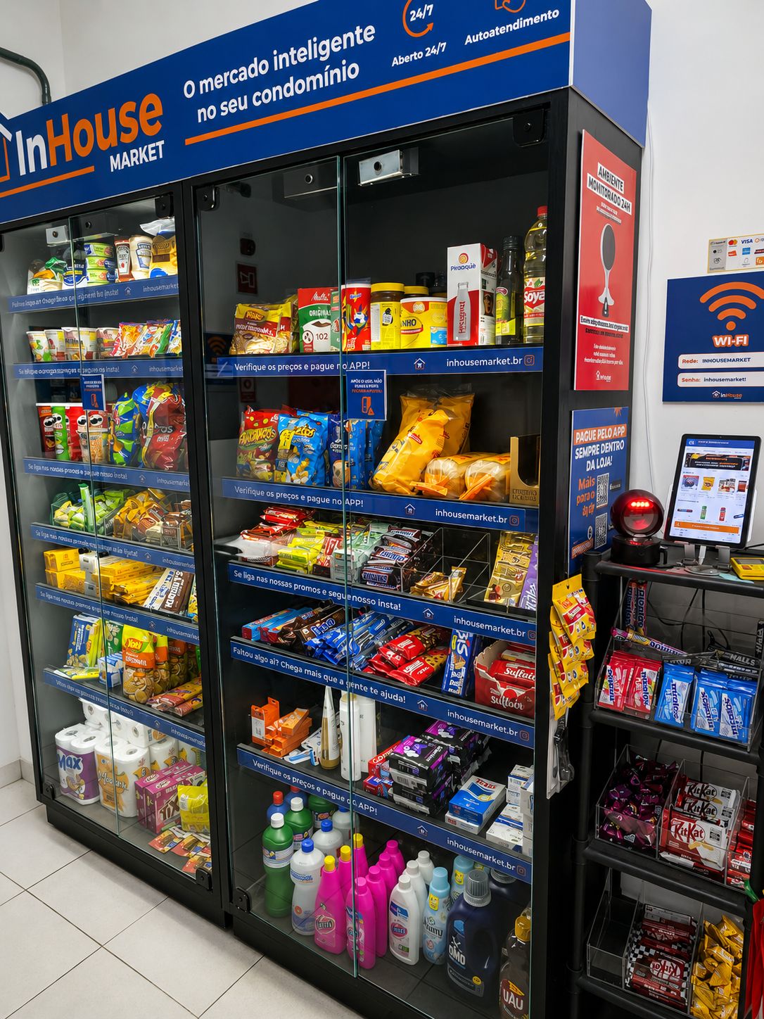 A self-service kiosk with a variety of snacks, beverages, and household items.