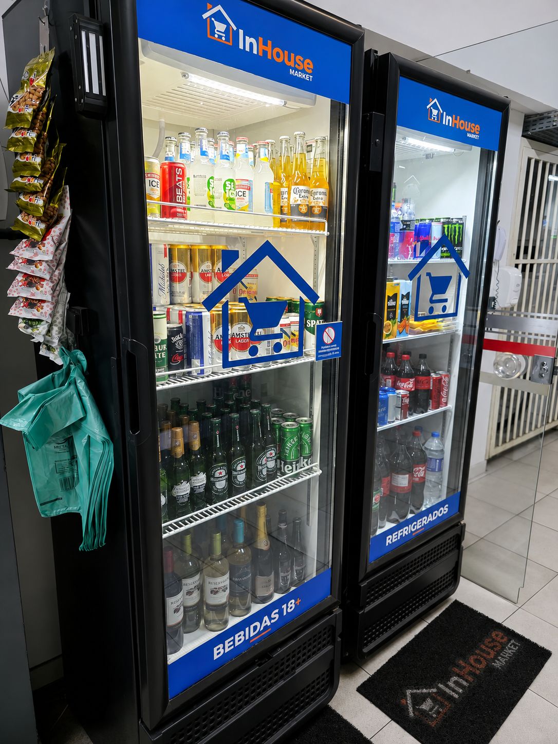 Two InHouse Market vending machines stocked with beverages and snacks.