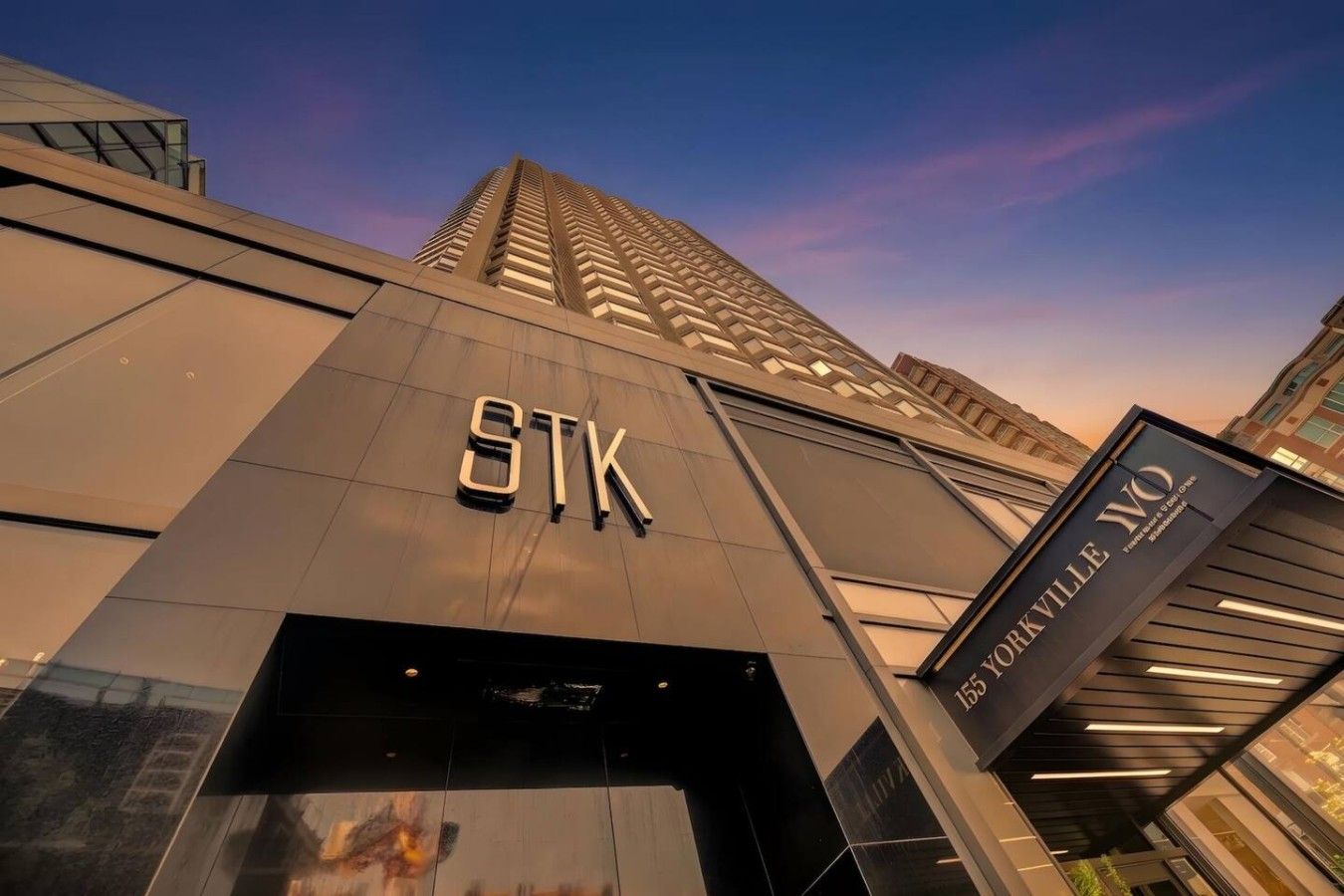 A modern building with the letters 'STK' prominently displayed on the facade.