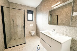 A bathroom with a glass-enclosed shower, a toilet, and a vanity with a sink. - 3-BR Villa with Private Pool Near the Beach (Zaton)