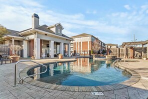 A swimming pool with a 3ft depth marker, surrounded by a brick patio, and adjacent to a building with a chimney. - The Northstar Condo - Minnesota meets Bama (Tuscaloosa)