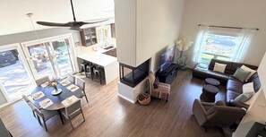 A spacious living area with a dining table, sofas, and a fireplace. - Bright & Spacious 3BR/2BA Home Close to Downtown and Sundance Film Festival (Boulder)