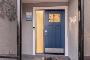 A blue door with a glass panel, a small window, and a doorbell. - Near Tampa, St. Pete & Top Beaches + Pet-Friendly! (Largo)