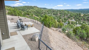 A patio with outdoor furniture, a view of a hilly landscape, and a clear sky. - Bryce Gateway Retreat — 2BR Cabin with Hot Tub & Mountain Views, Between Bryce & Zion (Alton)