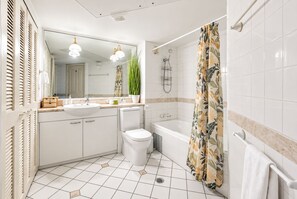 A bathroom with a sink, toilet, bathtub, and shower. - Heart of Cairns- Boutique apartment, Balcony & Pool (Cairns City)