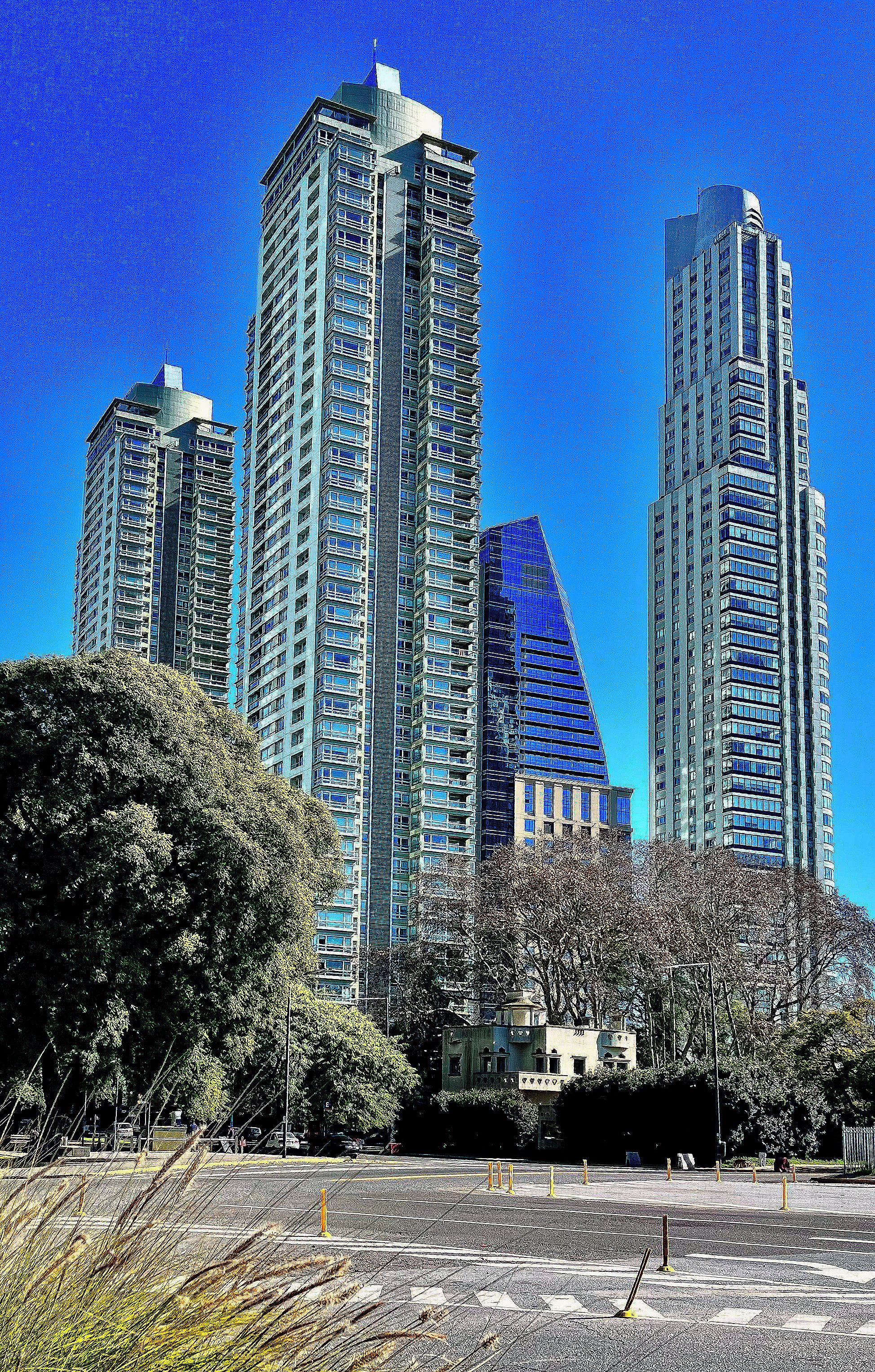 A high-rise building with multiple floors, large windows, and a modern architectural design.