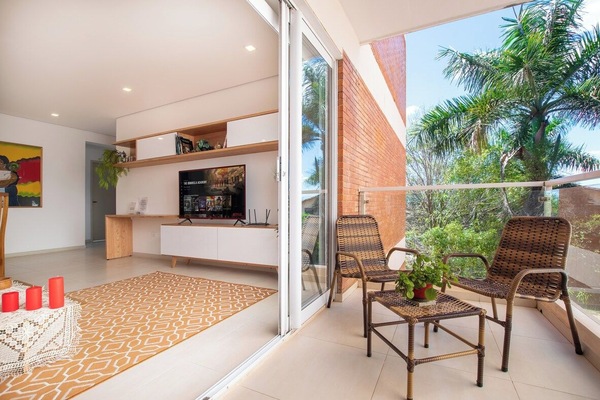 Bright living room opening to balcony