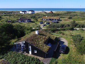 A coastal property with multiple buildings, a parking area, and a view of the sea. - "Senija" - 100m from the sea by Interhome (Fjerritslev)