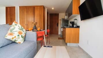 Suite estudio superior | Área de sala de estar