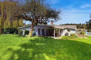 A house with a porch, a chimney, and a garden. - 2 BR Waterfront home on Bainbridge Island (Bainbridge Island)