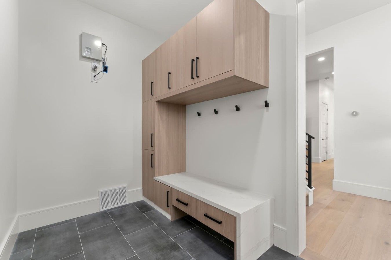 A modern bathroom with a shower, a toilet, and a sink.