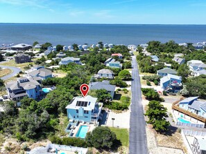 A residential area with houses, a swimming pool, and a view of the sea. - Oceanside- Private Pool, Hot Tub-SG113, Sandy Peach (Duck)