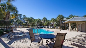 A pool area with lounge chairs and a covered seating area. - Pineapple Under the Sea– Great Florida Cottage Near 30A Beaches (Santa Rosa Beach)