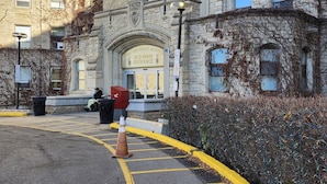 A historic building with a prominent entrance labeled 'Royal University Hospital Old Main Entrance.' - Brighton Escape, Spacious 2BR Walk-out Suite (Saskatoon)