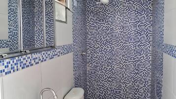 Shower, towels, soap, toilet paper