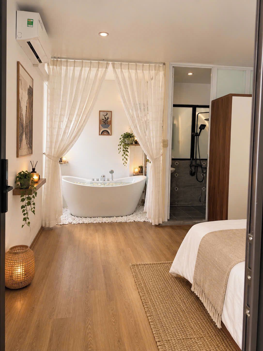 A modern bathroom with a freestanding bathtub, a shower area, and a bed with a woven rug.