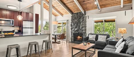 The open floor plan, vaulted ceilings and large windows allow your group to enjoy each others company from any cozy spot in this vacation rental.