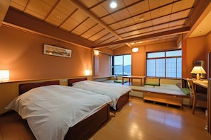A hotel room with two beds, a desk, and a large window. - Yunoyado Hakusan Shobutei (Kaga)