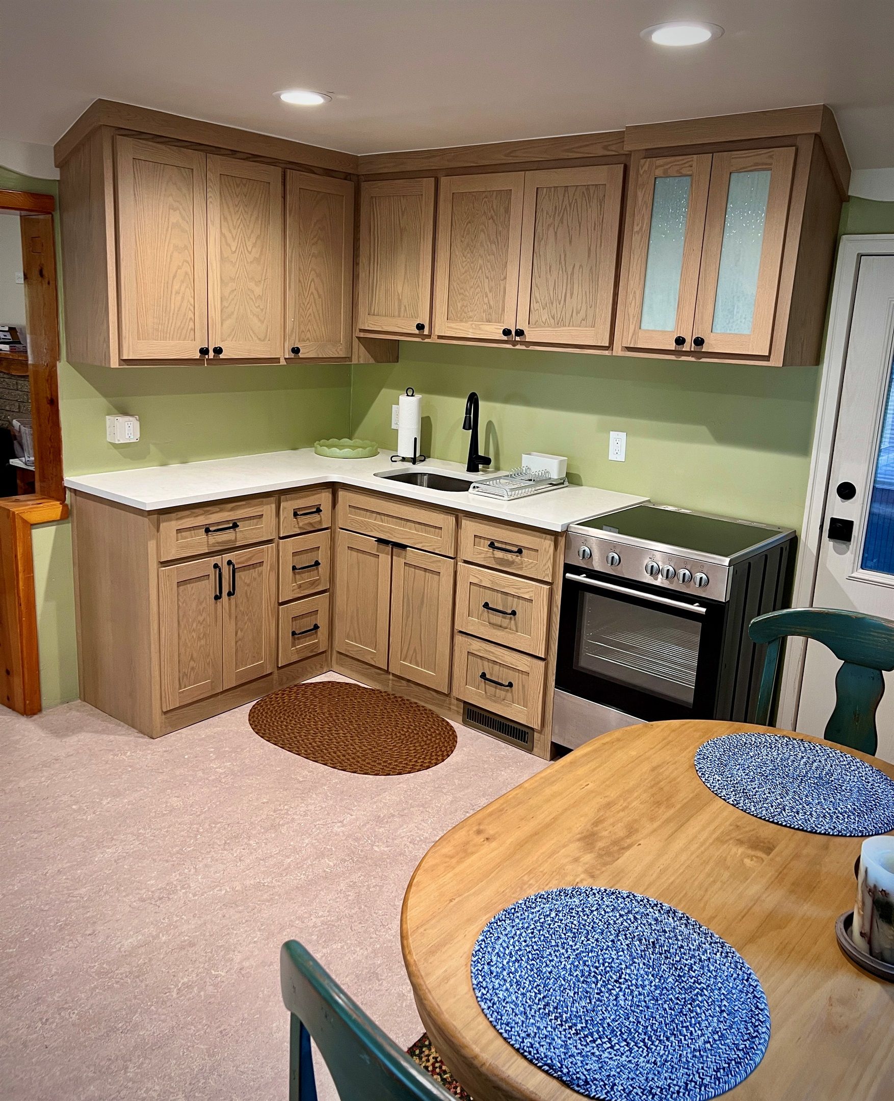 Kitchen with a range and round table