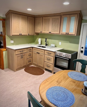 Kitchen with a range and round table