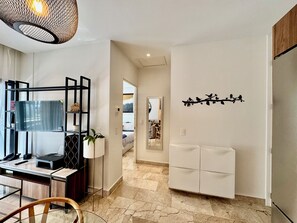 A modern interior with a desk, chair, and a decorative wall piece. - The Best Place in Playa del Carmen! (Playa del Carmen)