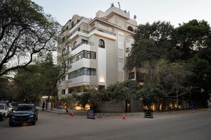 A multi-story building with a modern architectural design, featuring balconies and large windows. - Relax at bait assel by spacey #102 (cairo)