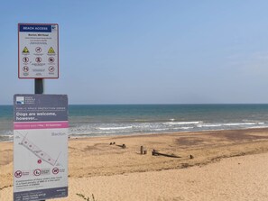 A beach access sign with beach access information and a public space protection order sign. - 2 bedroom accommodation in Bacton (Bacton)