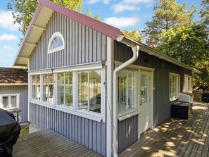 A two-story building with a covered deck area. - Villa niemelä by Interhome (Naantali)