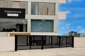 A modern building with a sign reading 'TOWNHOUSE Company Serviced'. - Townhouse Maralkunte Kateramma Temple (Bengaluru)