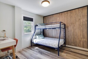 A bunk bed with a wooden wall and a window. - Poconos Mtn Getaway: 4 Mi to Camelback Resort (Tannersville)