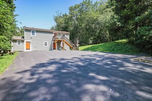 A two-story building with a wooden staircase leading to a porch. - Poconos Mtn Getaway: 4 Mi to Camelback Resort (Tannersville)