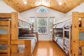 A room with bunk beds, wooden ceiling, and windows with blinds. - Hot Tub & Mtn Views! Big Bear All-Seasons Escape (Big Bear)