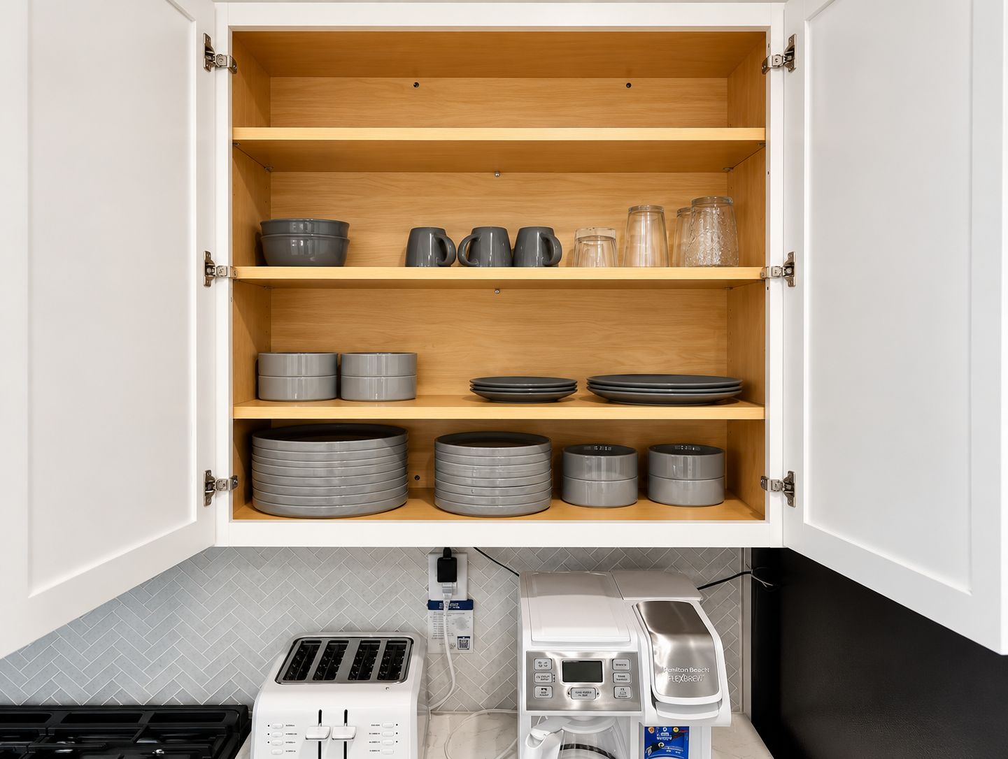 Serve meals with style using a fully stocked set of modern gray dishware.