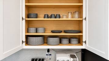 Serve meals with style using a fully stocked set of modern gray dishware.