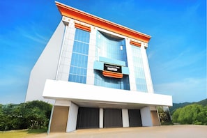 A modern building with a prominent sign reading 'TOWNHOUSE OAK'. - Townhouse Oak SR Nagar Metro Station (Hyderabad)