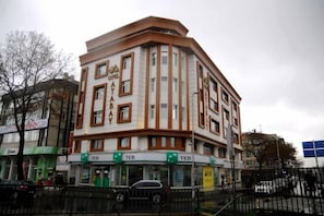 A corner building with multiple ground-floor shops, including a TEB. - Hotel Atabay (Istanbul)