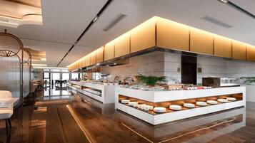 A modern kitchen with a central island, built-in cabinets, and a sleek design.