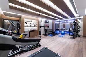 A modern gym with treadmills, weight machines, and exercise balls. - Braira Abha Hotel (Abha)