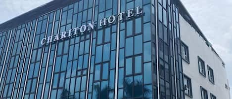 A modern building with the sign 'CHARITON HOTEL' indicating it is a hotel.