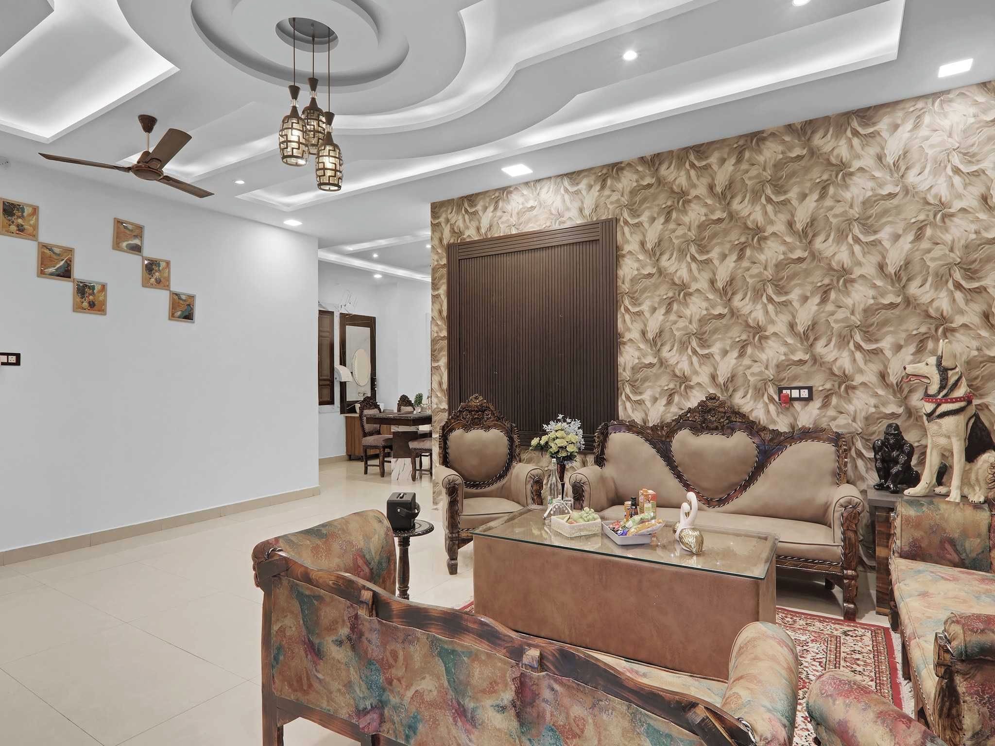 A spacious living room with a sofa, coffee table, and decorative items.