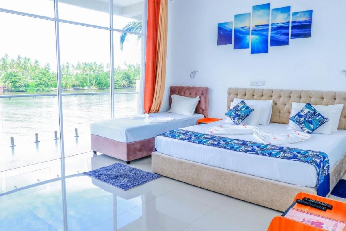 Deluxe-Suite, Balkon, Flussblick | Zimmersafe, schallisolierte Zimmer, Bügeleisen/Bügelbrett