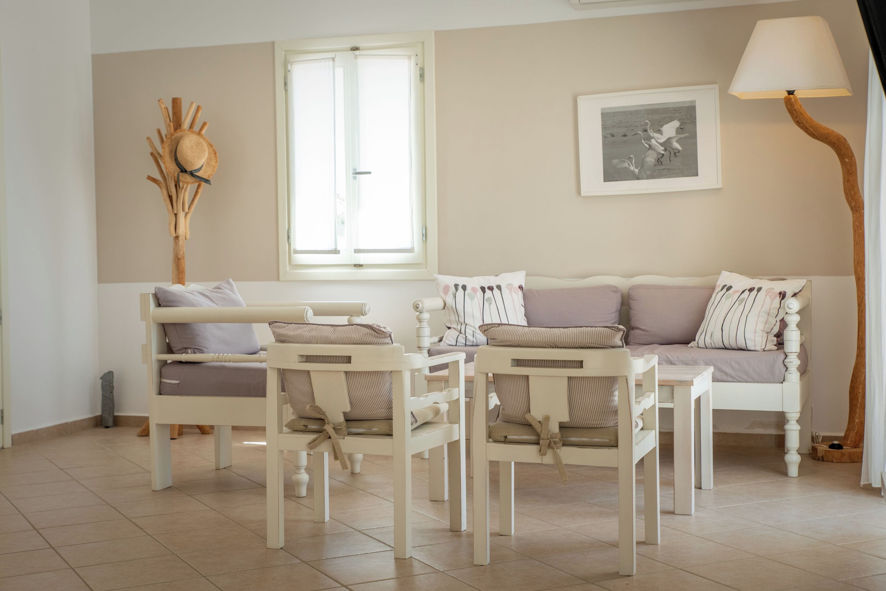 A living room with a sofa set, a coffee table, and a side table.